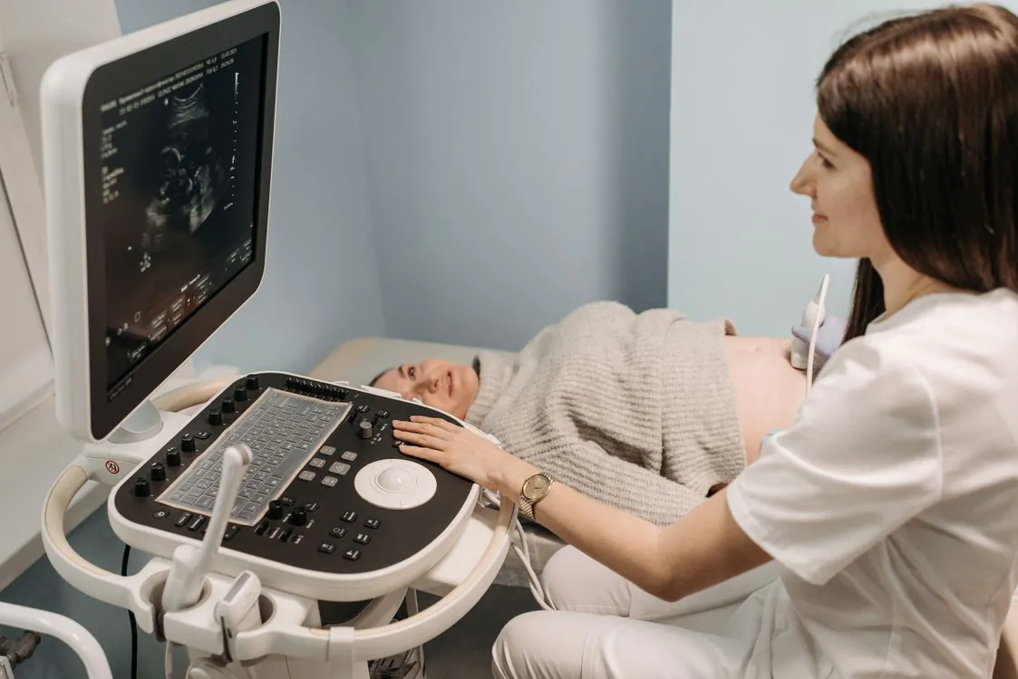 Doctor performing an ultrasound during a prenatal appointment